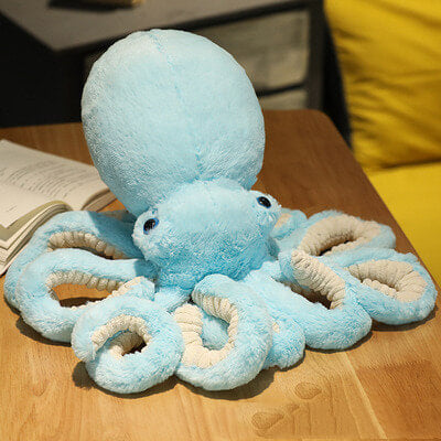 Grosse peluche pieuvre bleue pour décorer la chambre